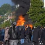 Motins anti-migrantes em Belfast, casas queimadas e caça a estrangeiros